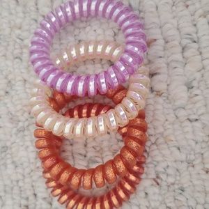 set of 4 coiled ties/bracelets (purple, cream, copper with sparkles,plain copper